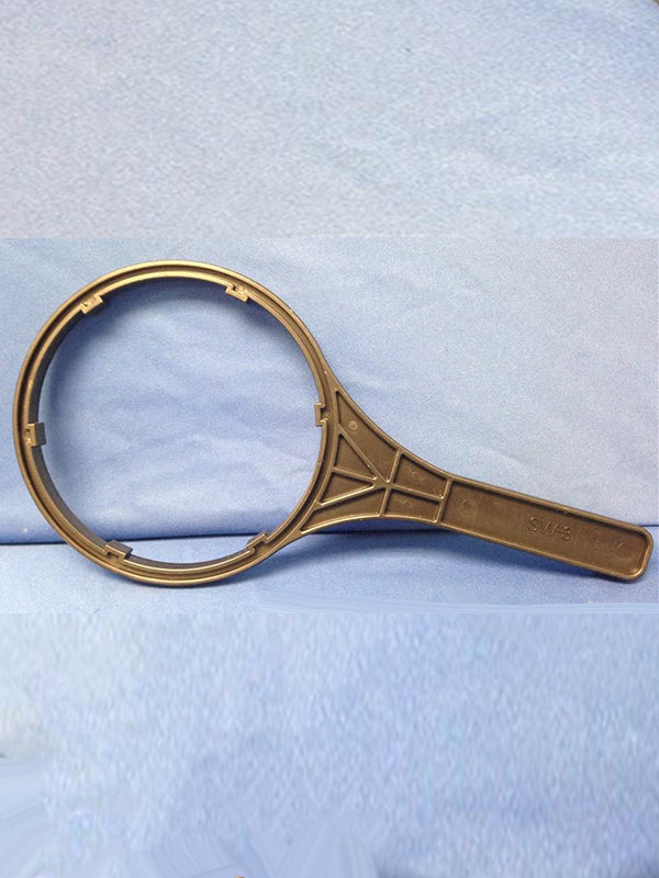 Photo of a brown BB housing wrench, 7/8" diameter